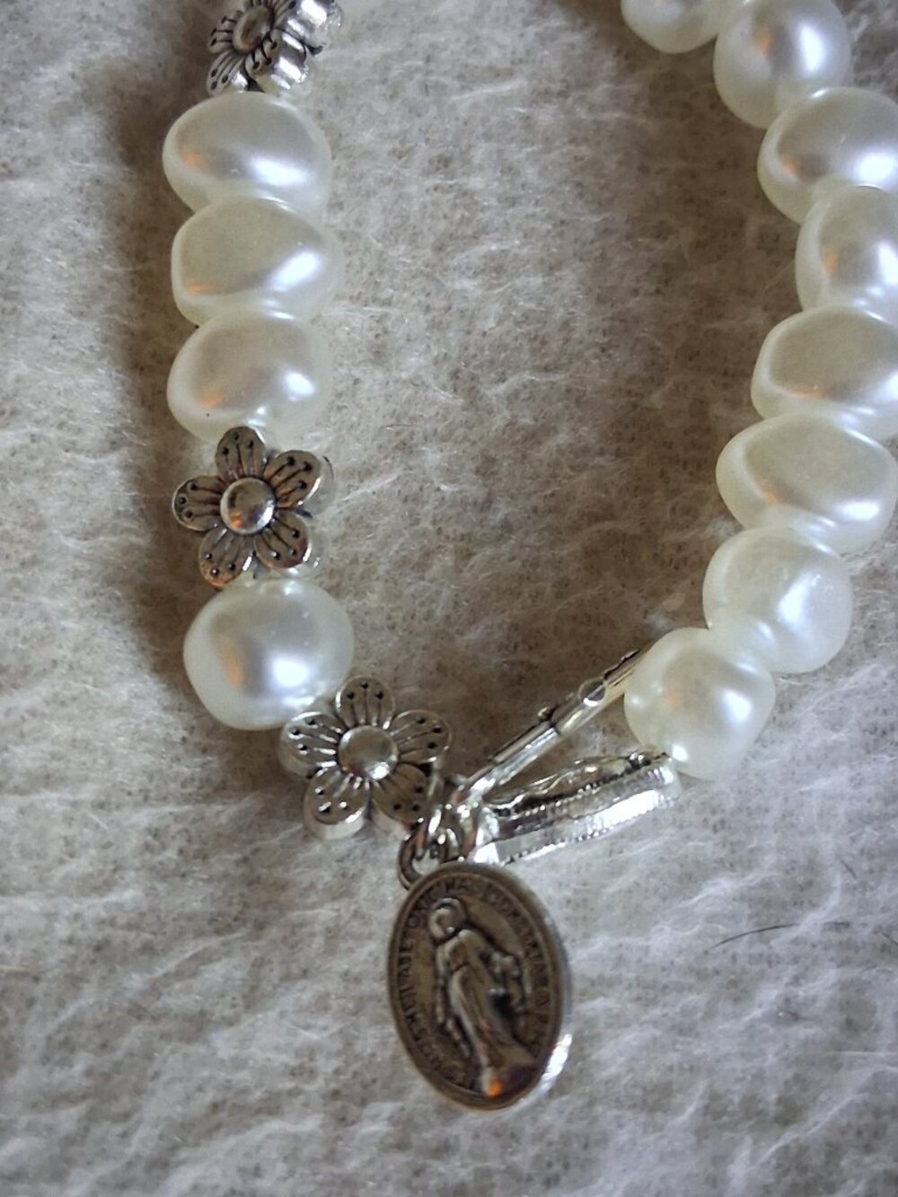 WHITE PEARL BRACLET WITH BLESSED MOTHER CHARM